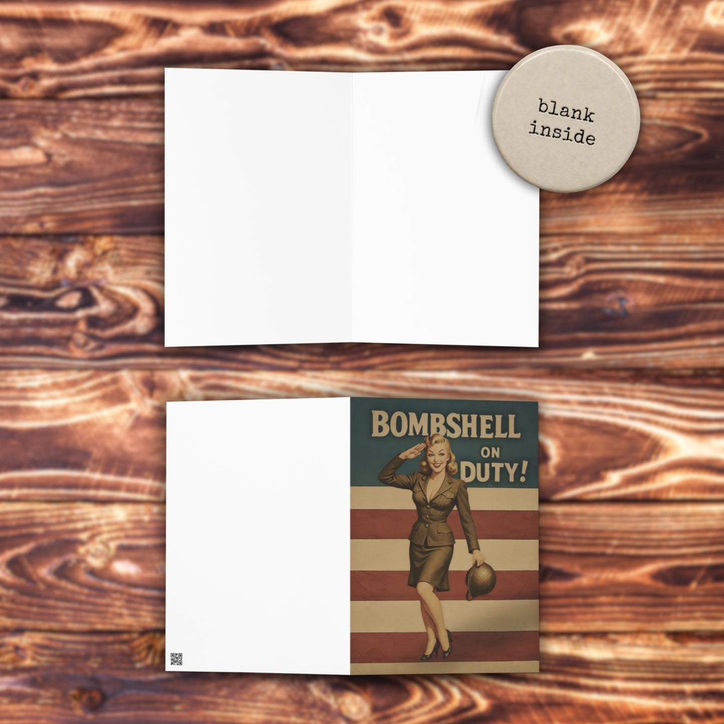 Note card with 'Bombshell on Duty!' design and blank inside text on a wooden surface