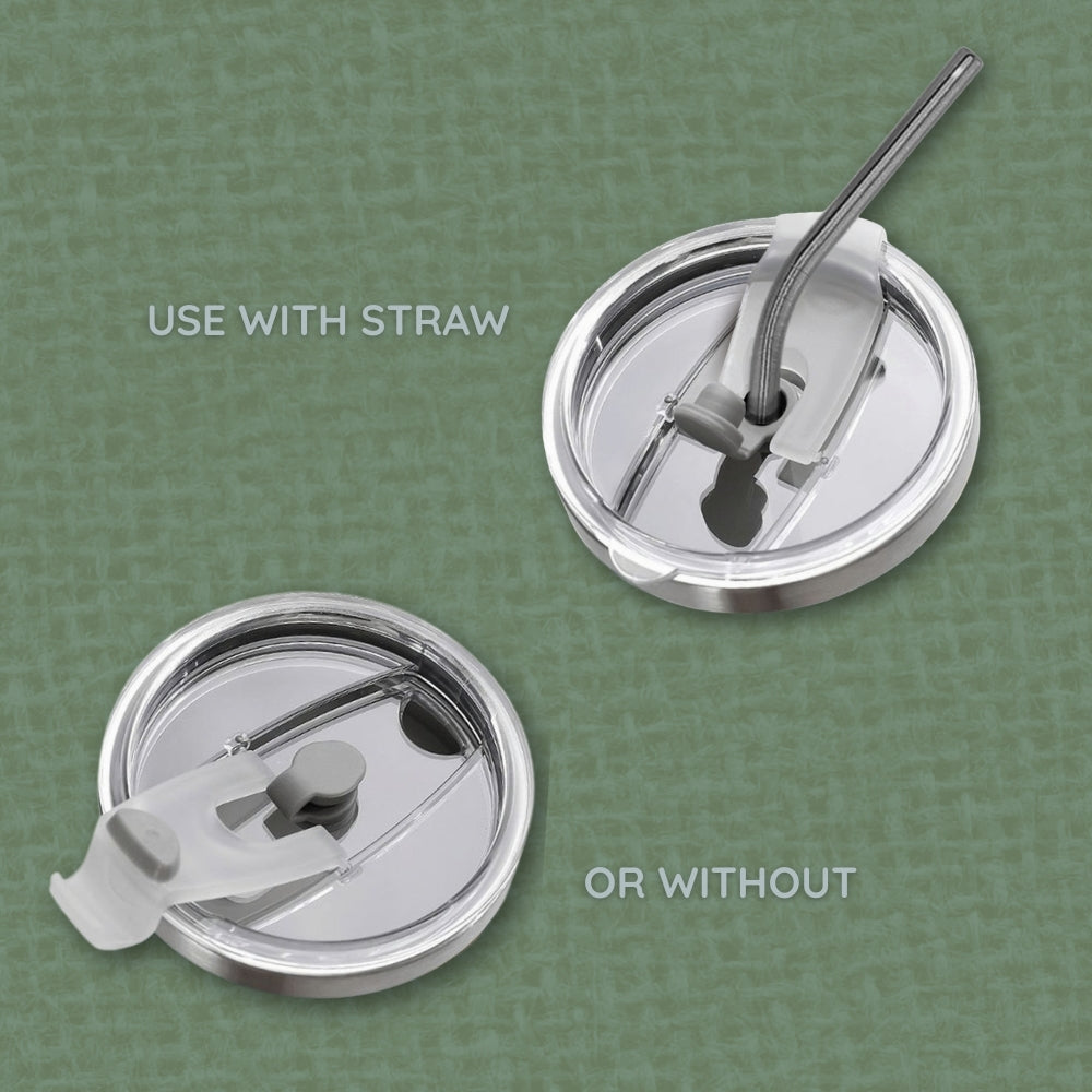 Two silver drink lids with straws on a green background