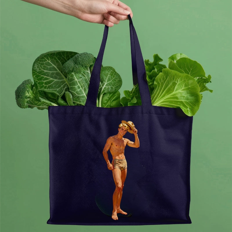 Navy tote bag with a graphic of a man and vegetables on a green background