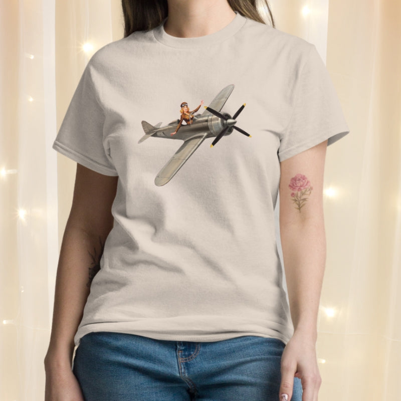 Person wearing a t-shirt with an airplane graphic design.
