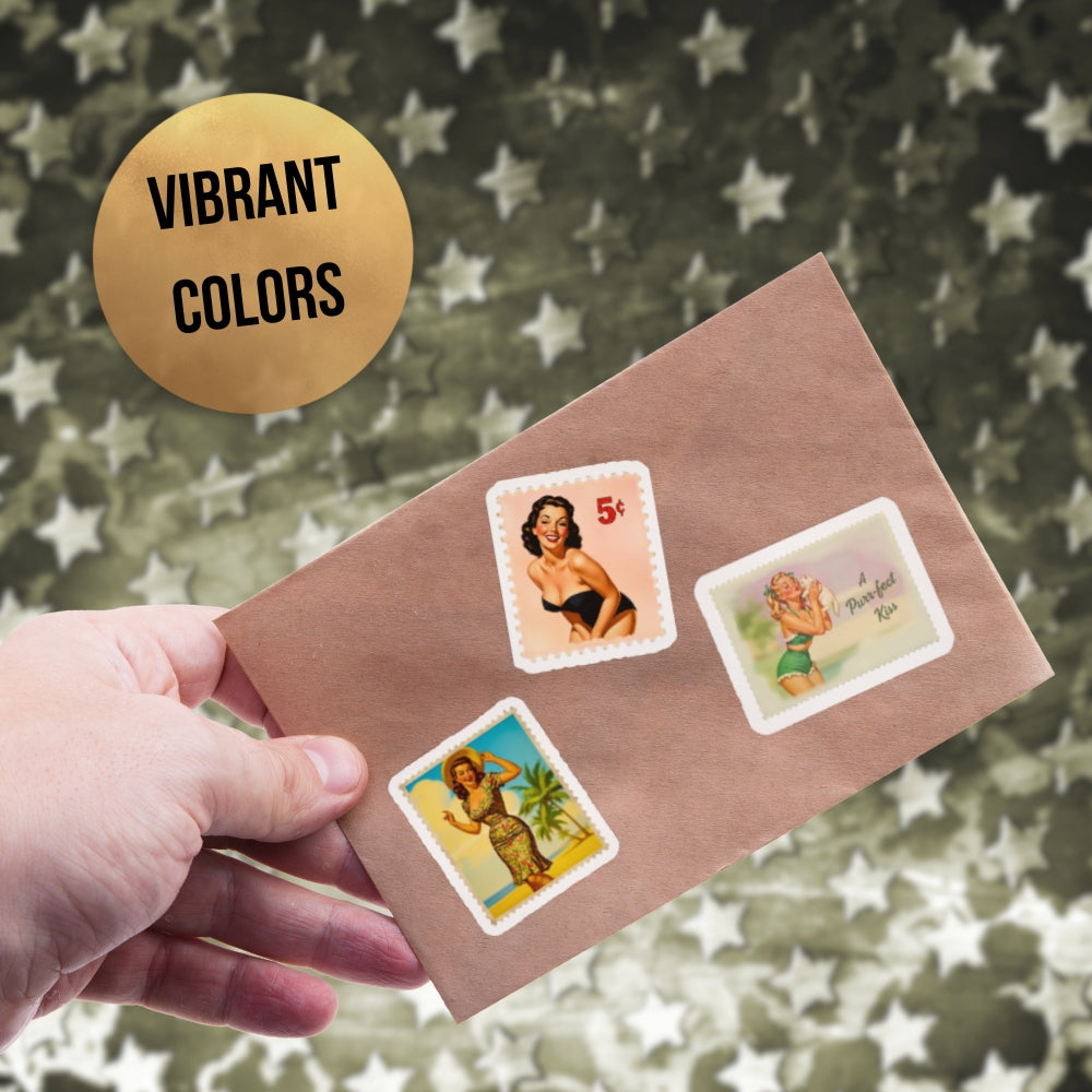 Hand holding a brown envelope with vintage-style stamps featuring women on a camouflage background.