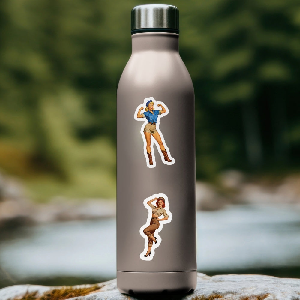 Metal water bottle with pin-up girl stickers on a natural background