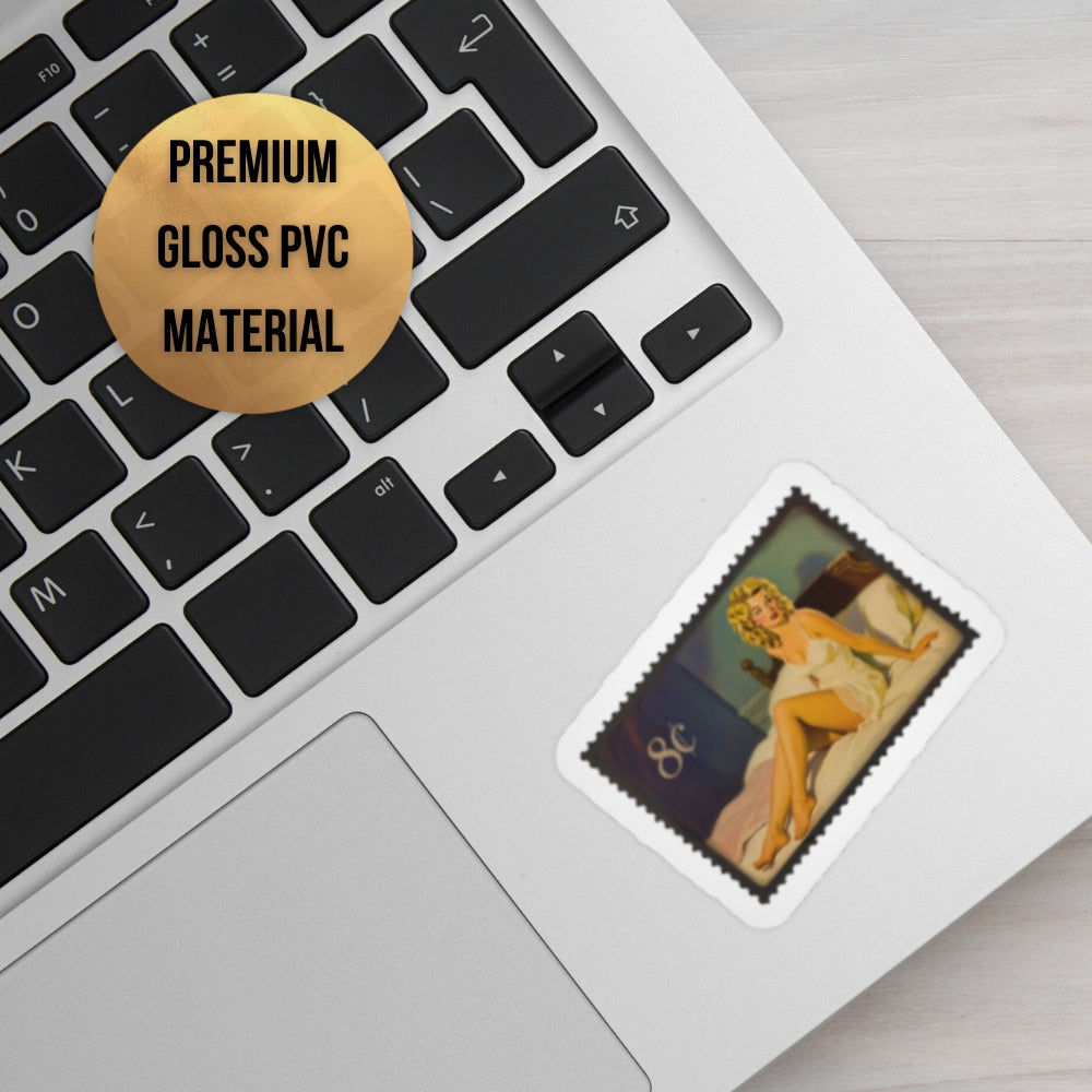 Laptop with a sticker of a nude figure on the palm rest area, labeled 'Premium Gloss PVC Material'.