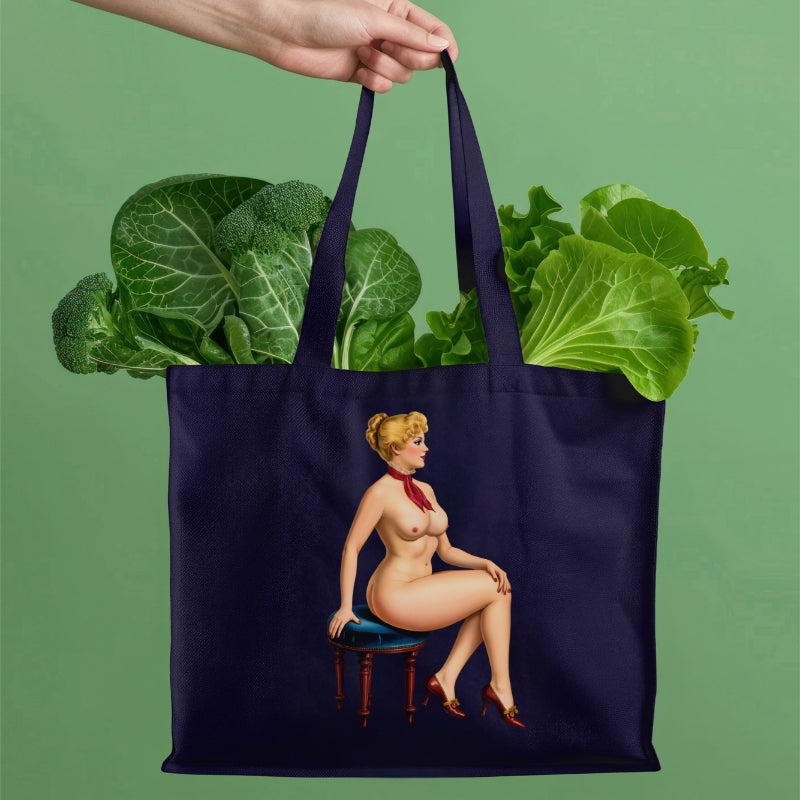 Navy tote bag with a graphic of a nude woman holding groceries on a green background