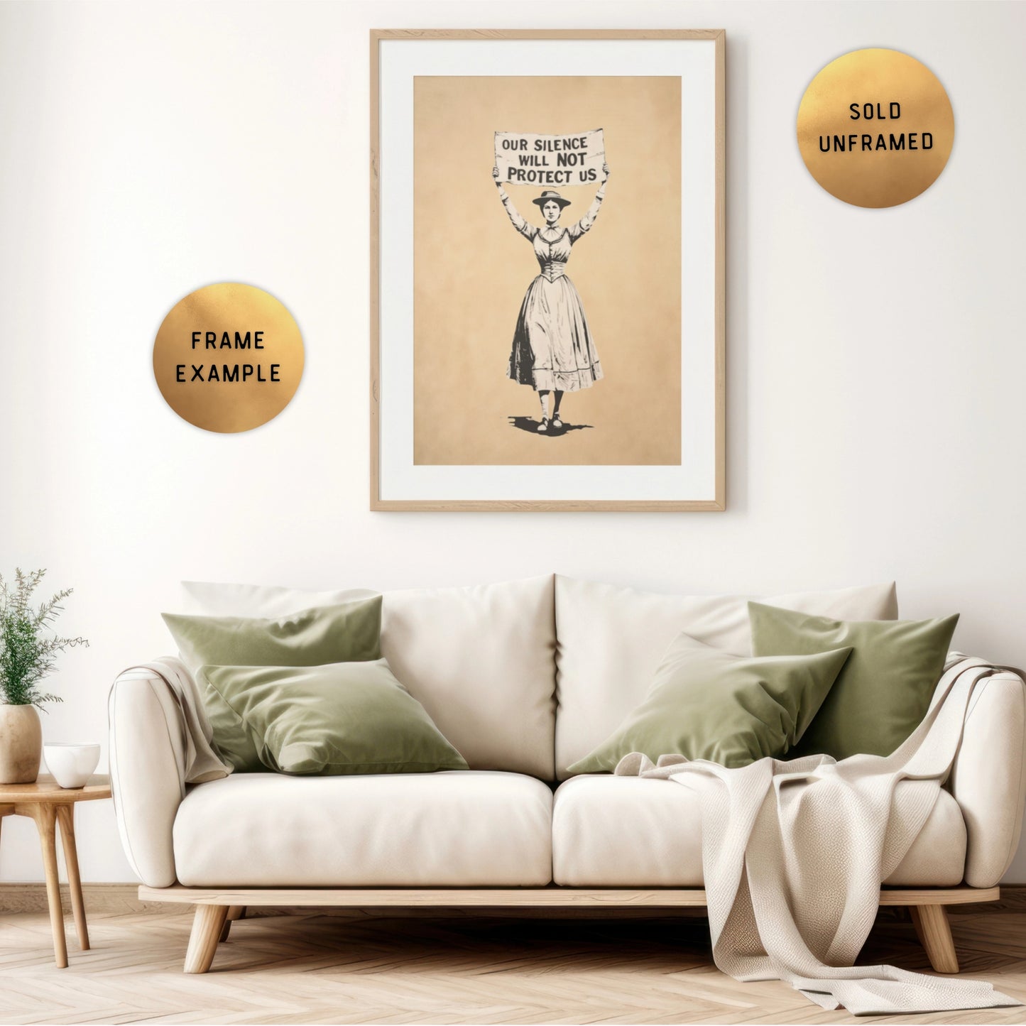 Framed artwork above a sofa in a living room setting, with sign that says: Our Silence Will NOT Protect Us