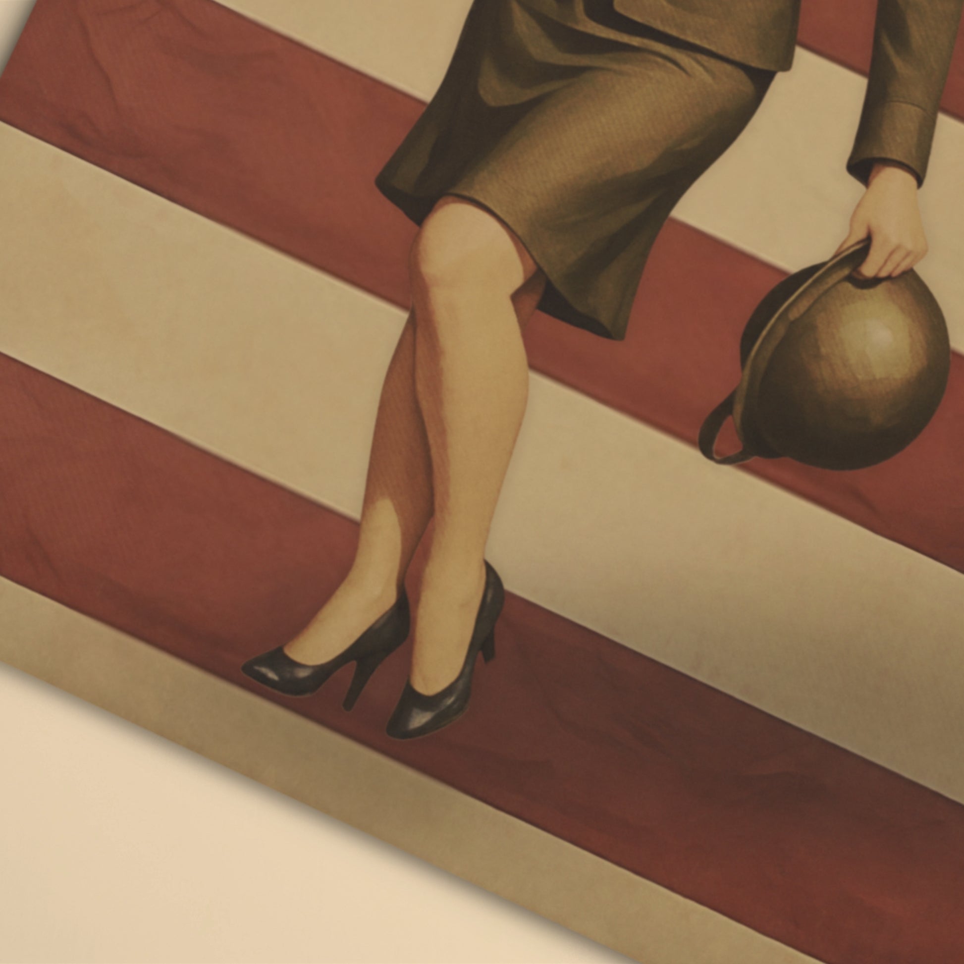 Woman's legs in high heels and a skirt, holding a handbag on a striped floor.