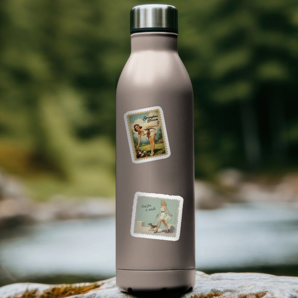Metal water bottle with vintage-style labels on a natural background