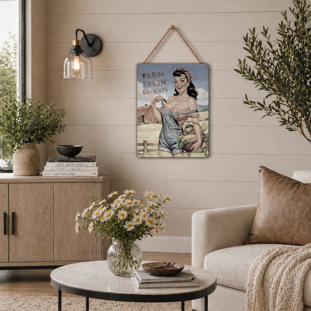 Farm Fresh Delights country pinup farm girl metal sign displayed on a living room wall, with rope used to hang the signage