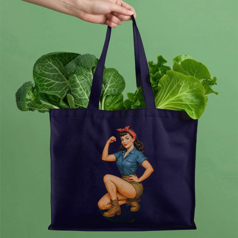 Navy tote bag with a graphic of a woman holding vegetables on a green background
