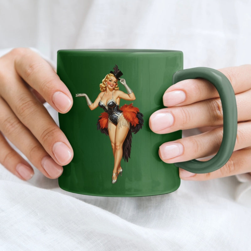Green mug with a pin-up girl design held by two hands against a white background