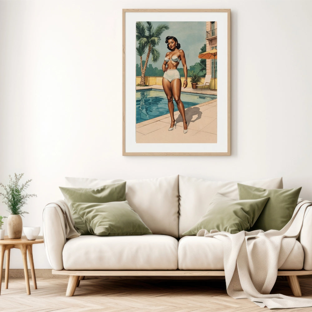 Framed artwork of a black woman in a bikini by a pool on a wall above a beige sofa with green pillows.