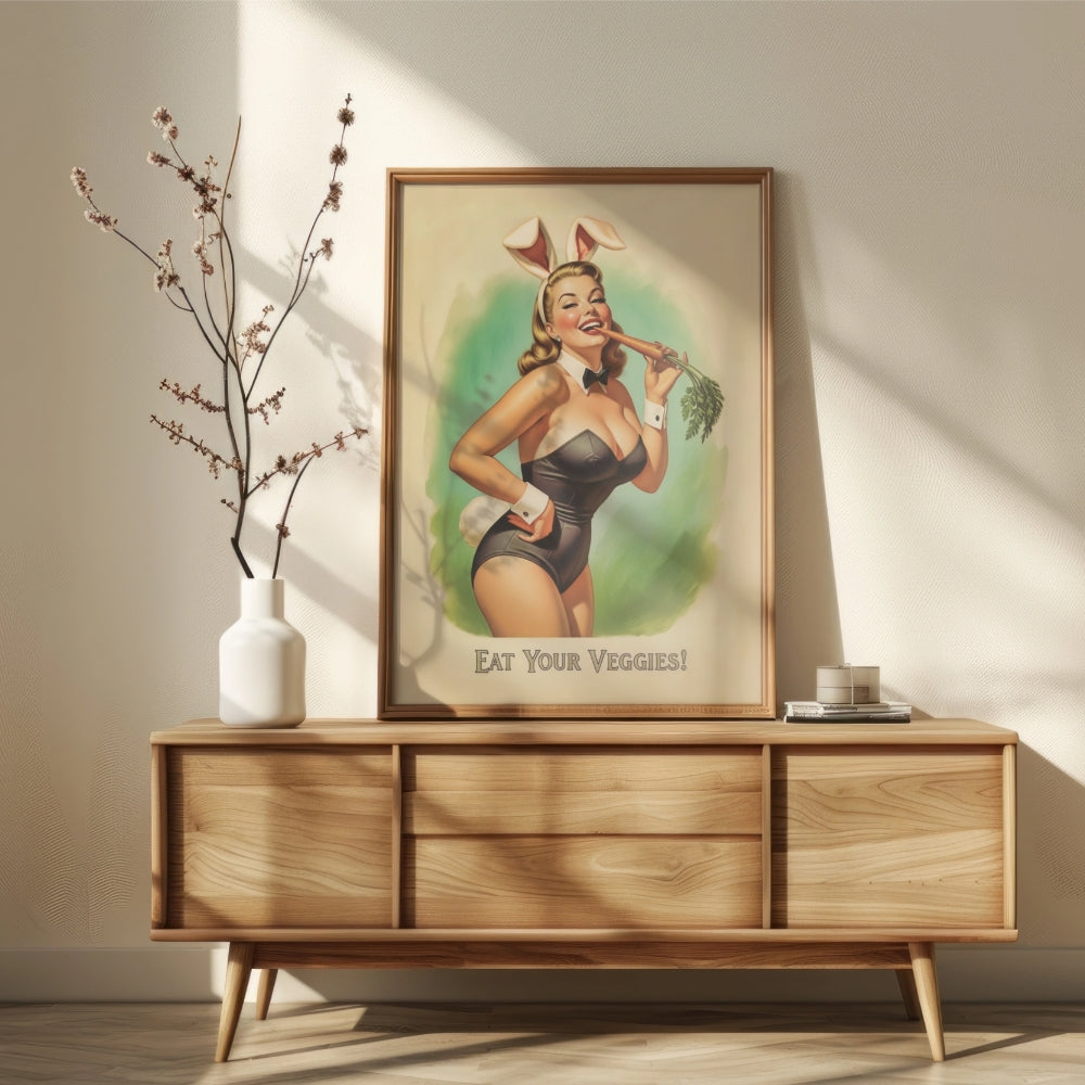 Framed poster of a woman in bunny ears on a wooden sideboard with a vase and plant.