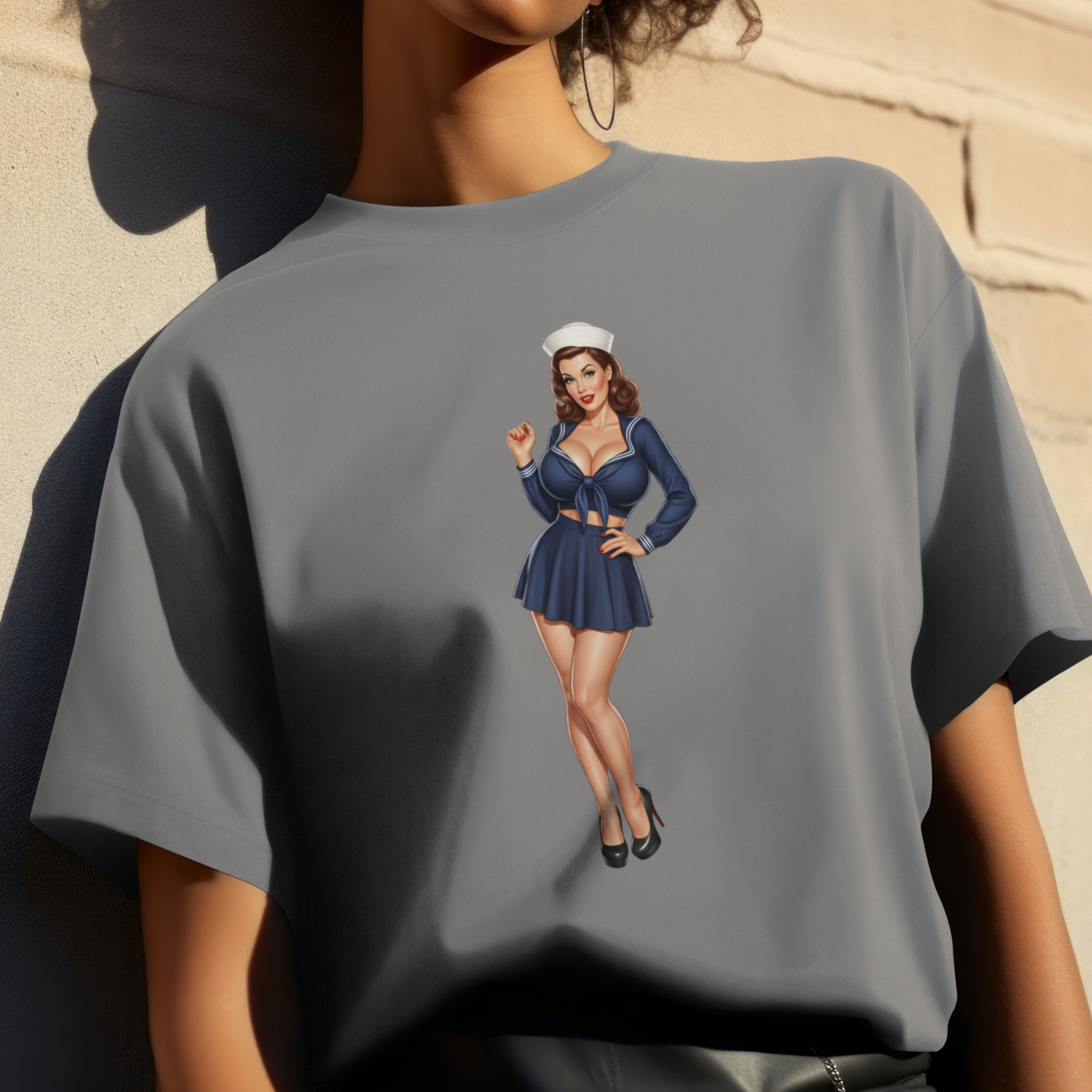 Gray t-shirt with a graphic of a woman in a blue outfit on a beige background