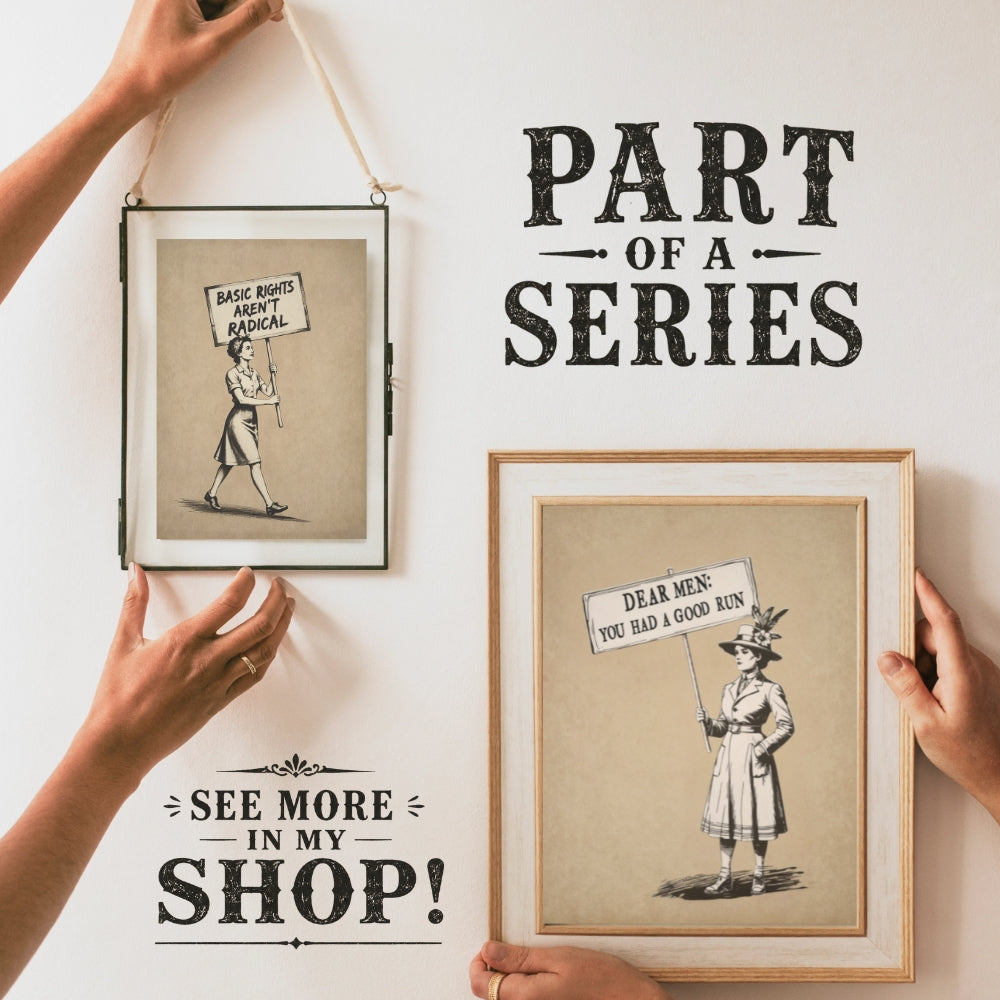 Two framed illustrations with text on a white wall, one being held by a person.