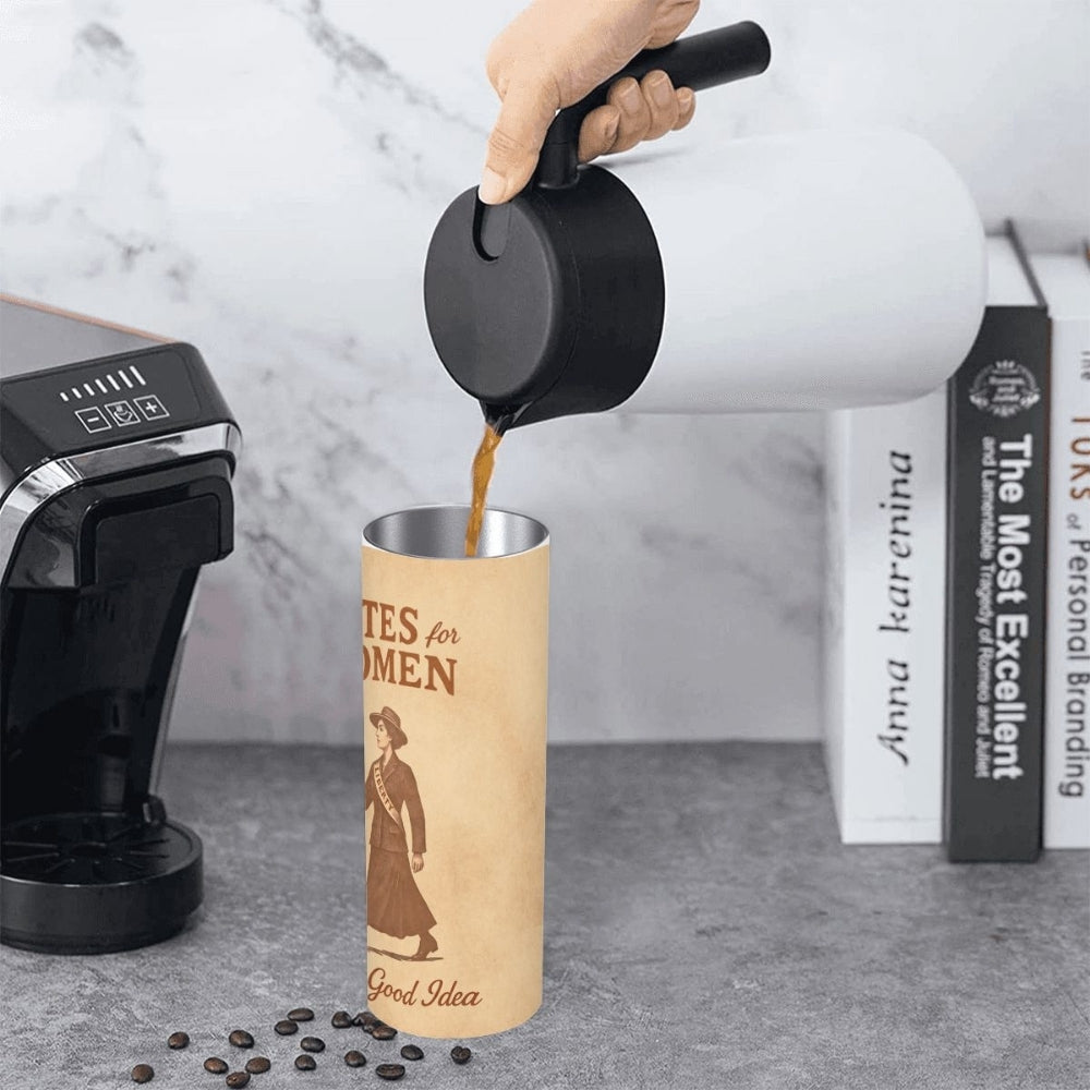 Person pouring coffee from a black pitcher into a cylindrical votes for women tumbler shown from the side