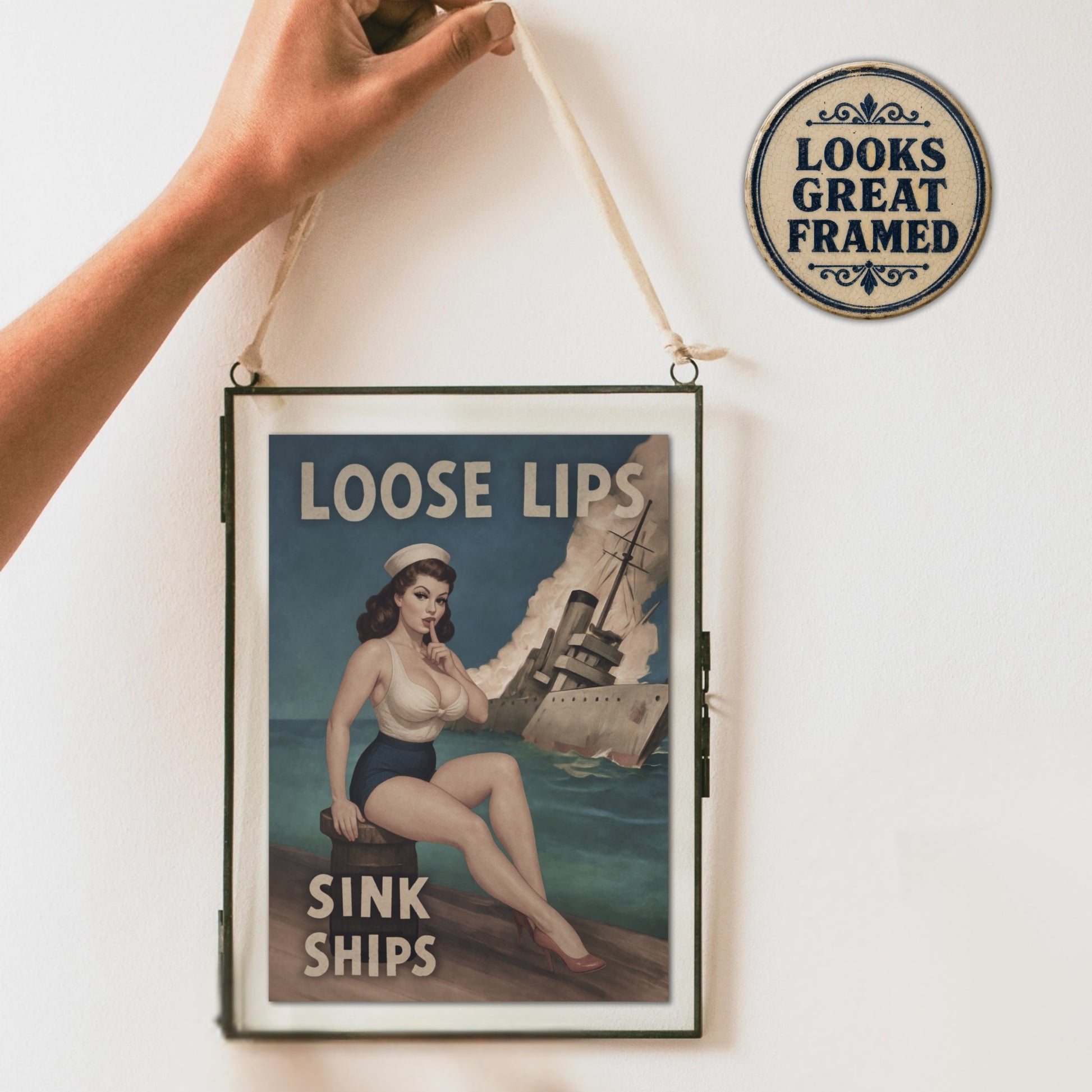 Vintage-style poster card with a woman and ship, text 'Loose Lips Sink Ships', framed and hanging on a wall.
