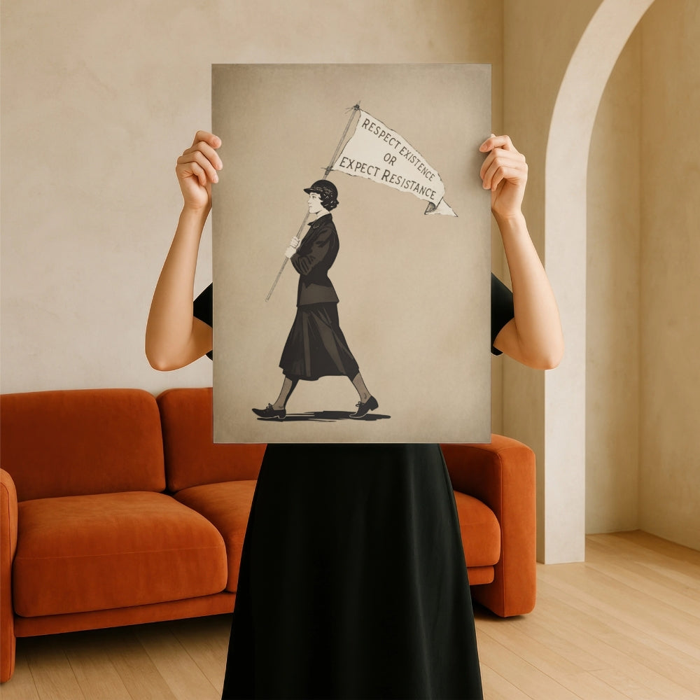 Person holding a framed feminism Respect Existence or Expect Resistance artwork of a woman with a banner indoors.