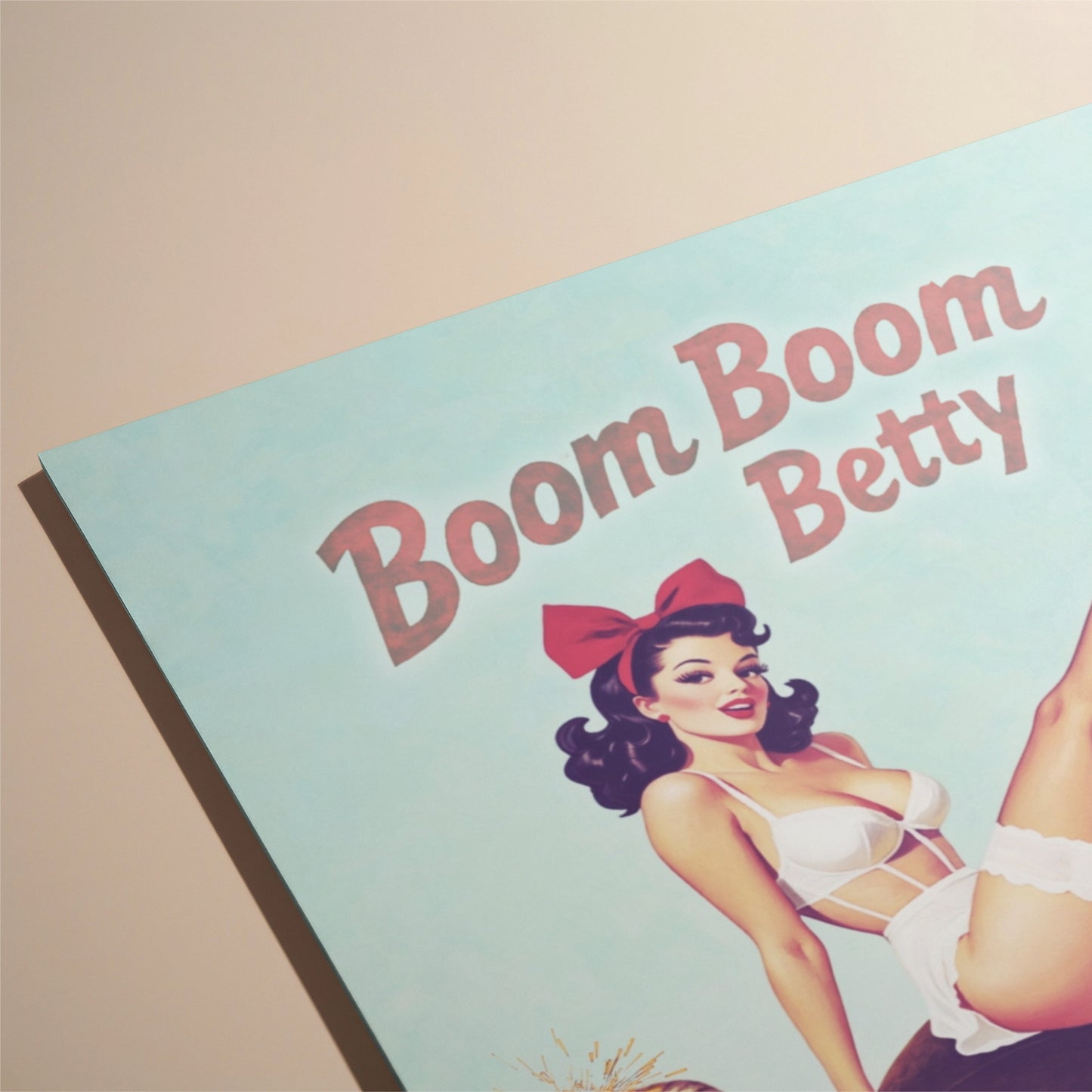 Vintage-style pinup girl card with 'Boom Boom Betty' text and a pin-up girl on a light blue background.