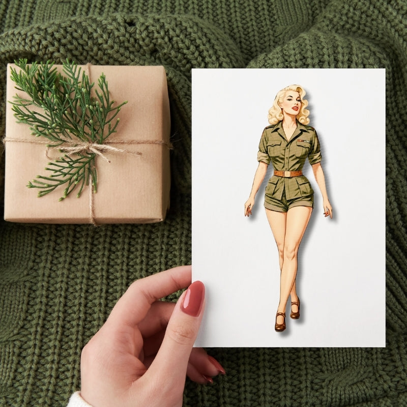 Gift wrapped in brown paper with greenery on a textured green fabric background, with a hand holding a card featuring a woman in a green outfit.