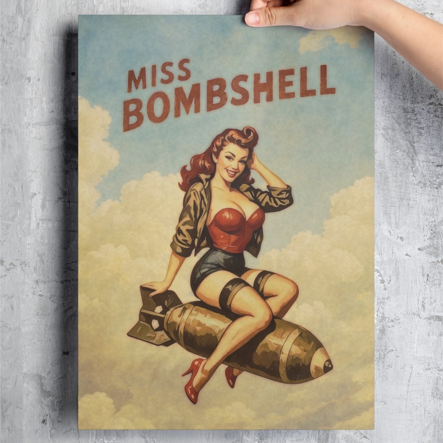 Poster of a woman sitting on a bomb with 'Miss Bombshell' text, held against a textured wall.