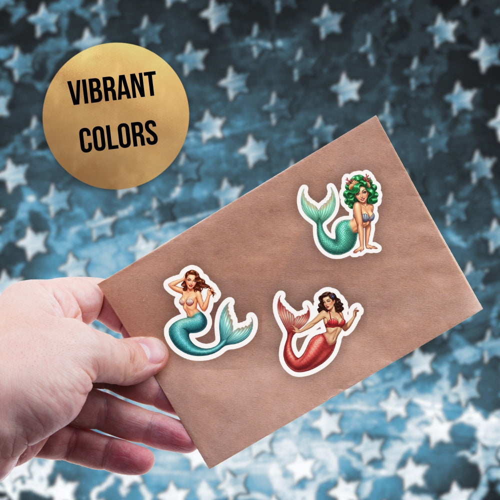 Mermaid stickers on a brown card with a starry background