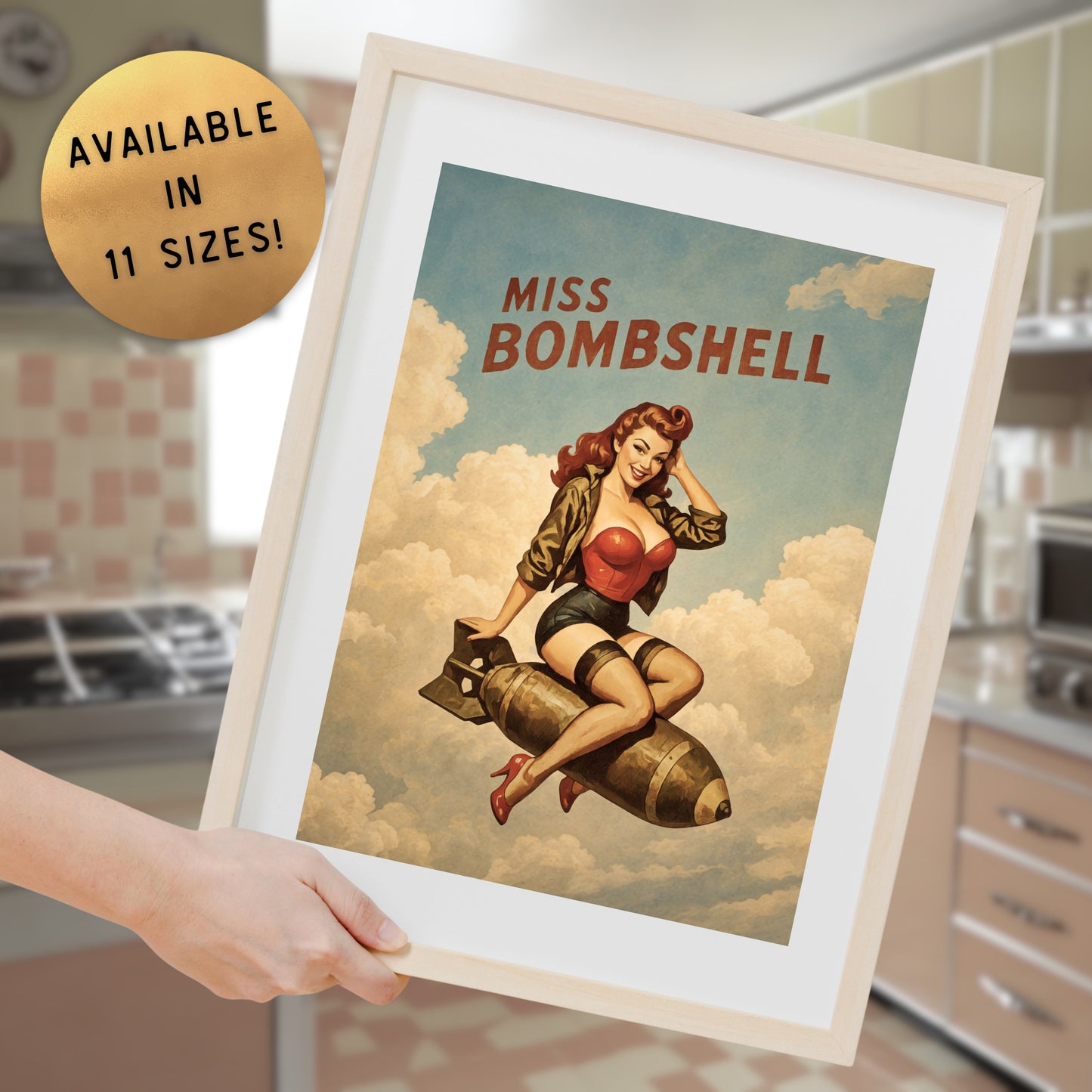 Framed poster of 'Miss Bombshell' with a person holding it in a kitchen.