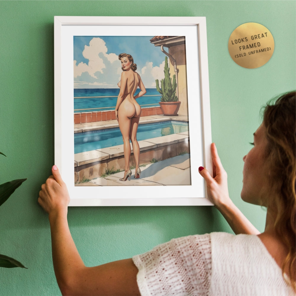 Woman holding a framed artwork of a woman by a pool with a green wall.