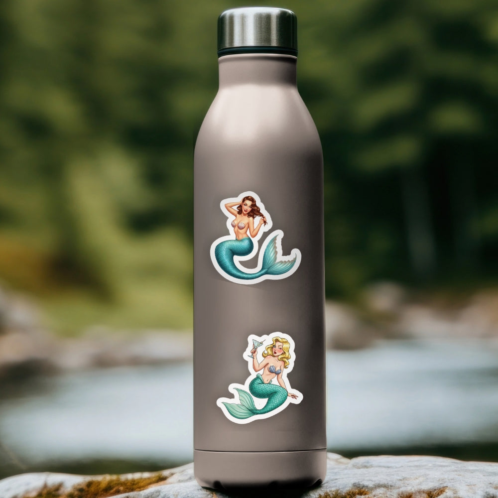 Stainless steel water bottle with mermaid stickers on a natural background