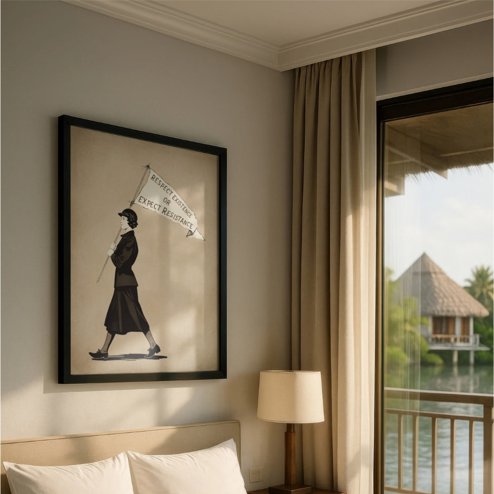 Framed vintage suffragette Respect Existence or Expect Resistance artwork on a wall with a lamp and window view in the background