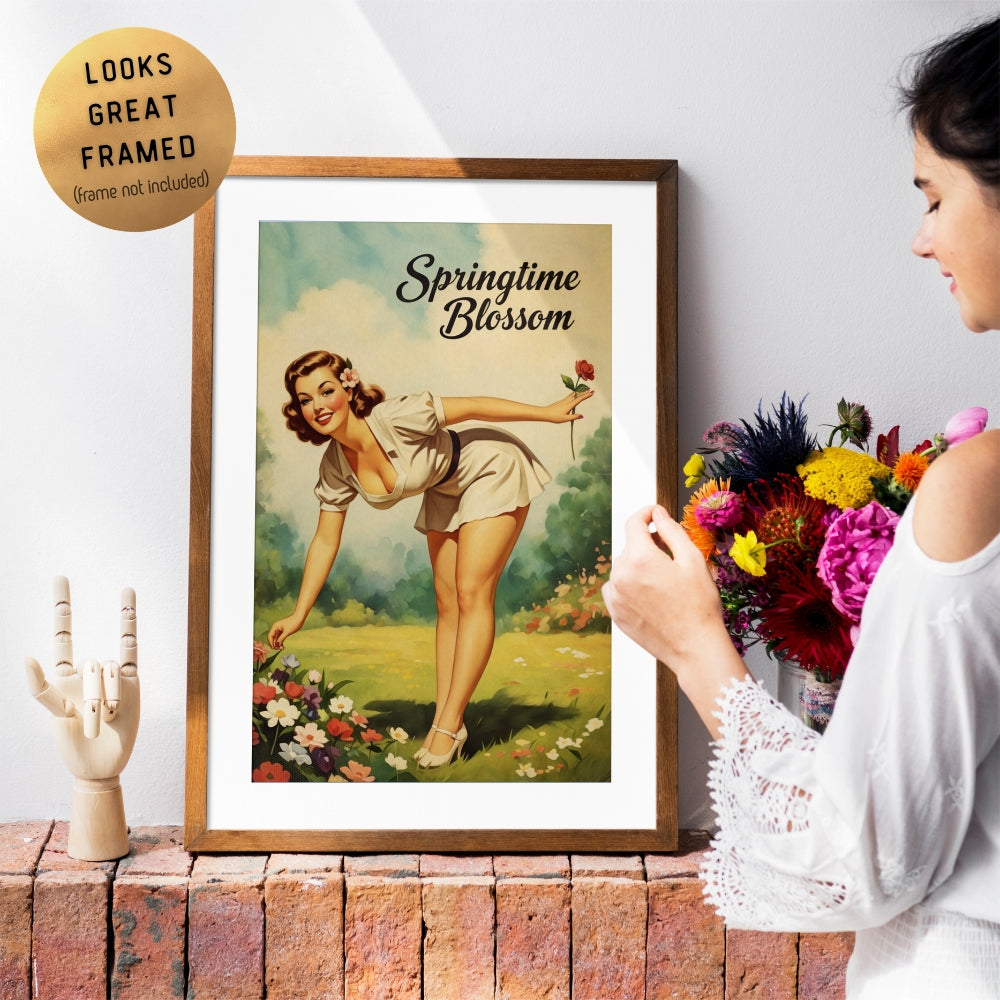 Framed artwork titled 'Springtime Blossom' with a woman in a garden, held by a person.