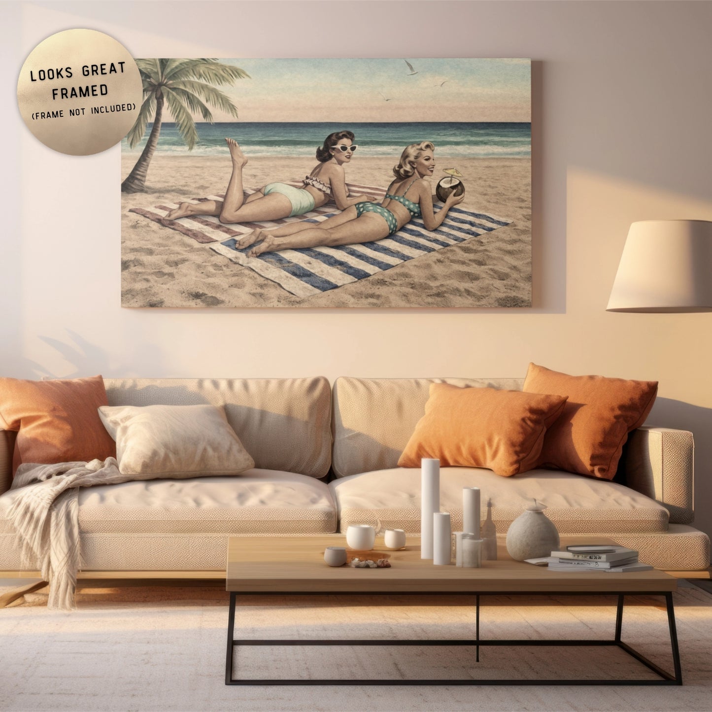 Living room with a couch, coffee table, and a framed picture of two women on a beach.