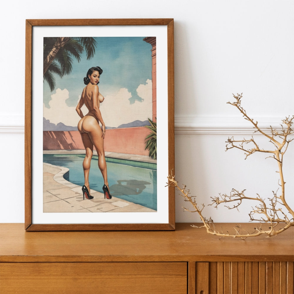 Framed artwork of a woman by a pool with palm trees on a white wall.