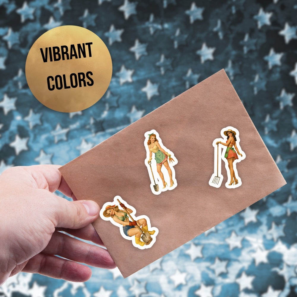 Hand holding a brown envelope with stickers of women in swimsuits against a star-patterned background.