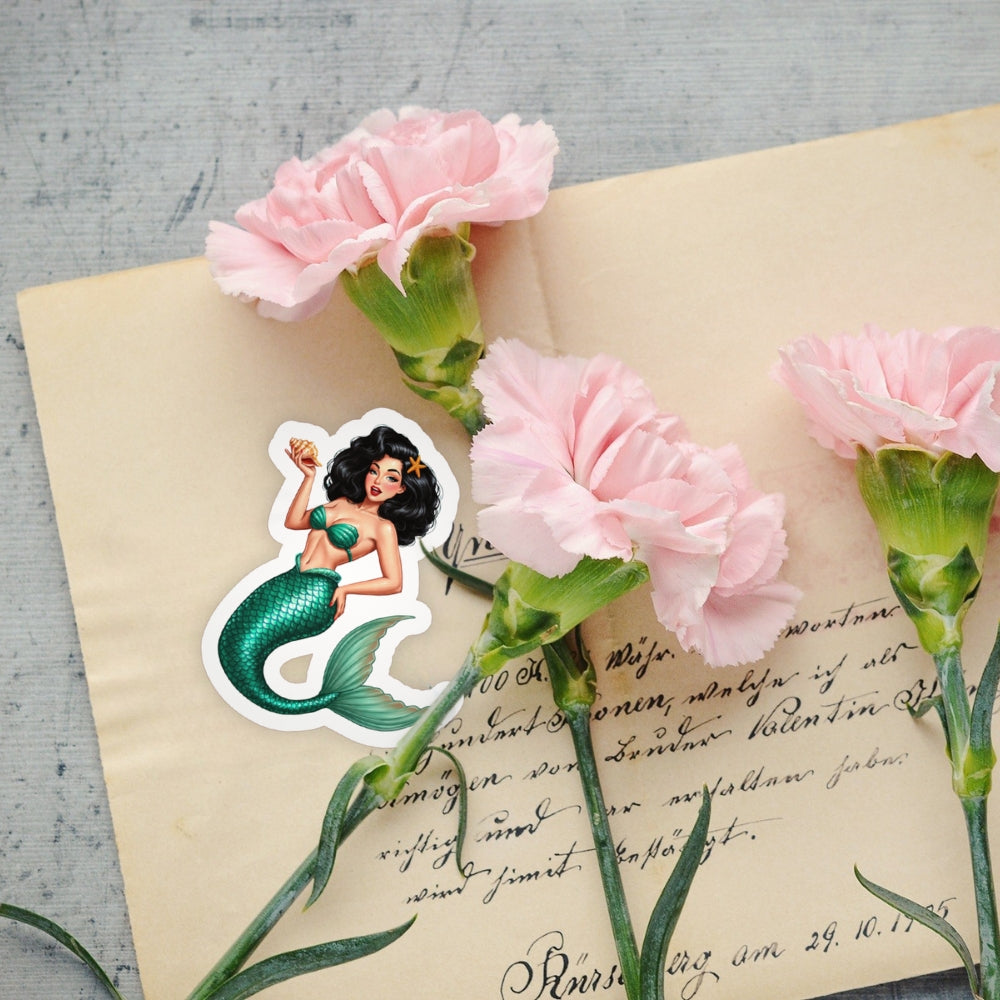 Pink carnations on an old letter with a mermaid sticker