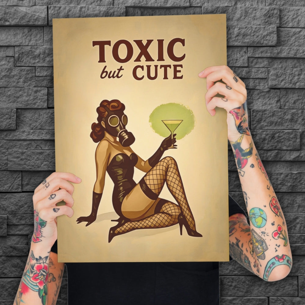 Person holding a poster with a graphic design of a woman in a gas mask and lingerie, with text 'Toxic but Cute' against a stone wall background.