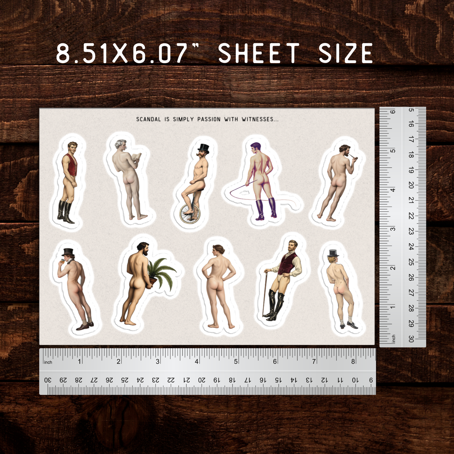 Sheet of stickers with various poses on a wooden surface with rulers for scale.